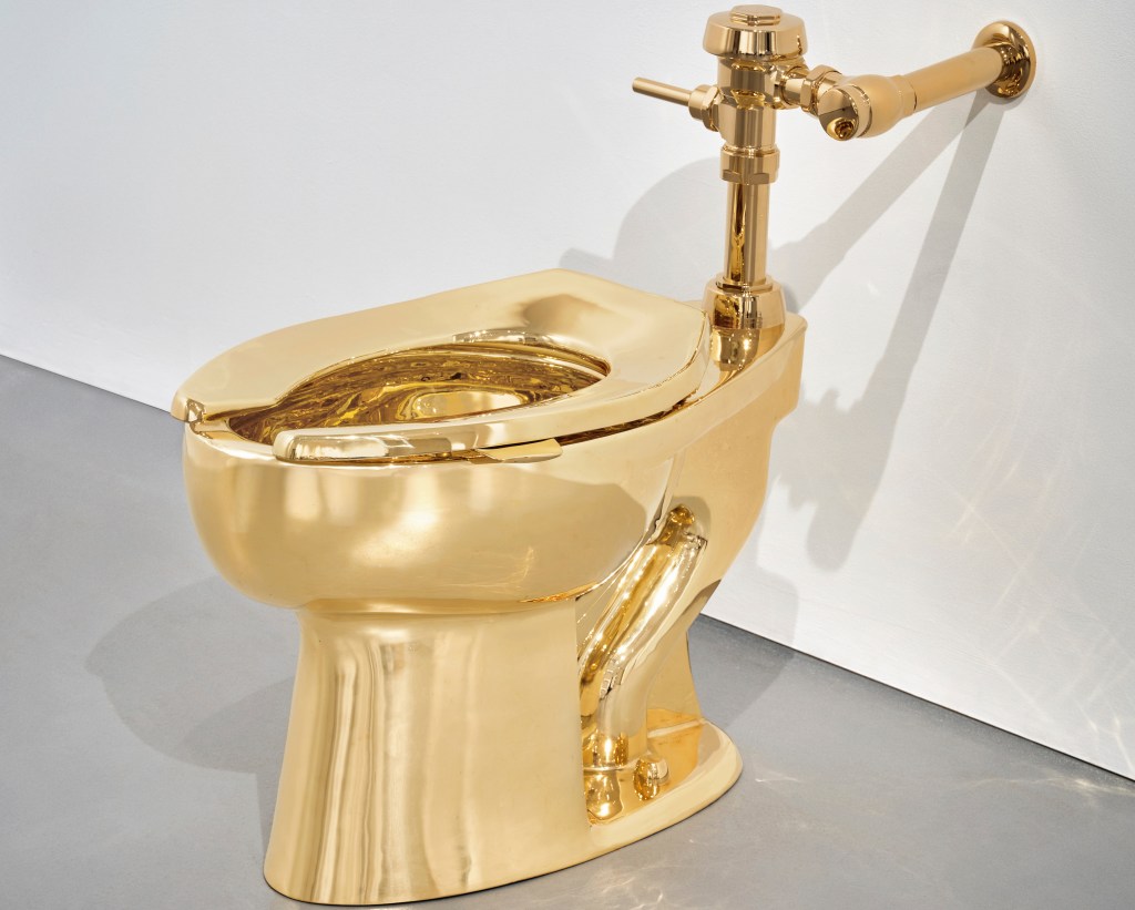 Ripley’s buys gold toilet for record $12 million